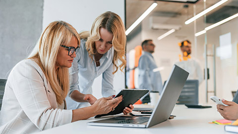 Two people working on a project in an office