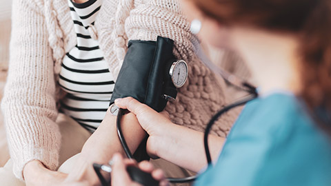 An elderly person getting blood pressure taken