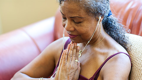 Senior Woman meditating at home