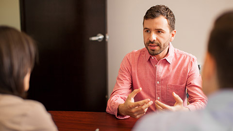 A person talking to colleagues