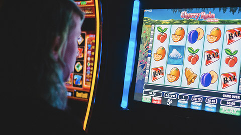 A person playing the pokies