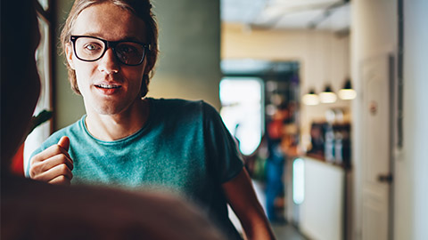 A person listening to another person speaking