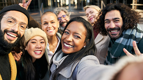 A diverse group taking a selfie