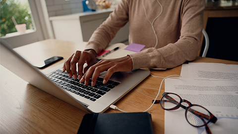 Close-up of busy female hand typing on keyboard