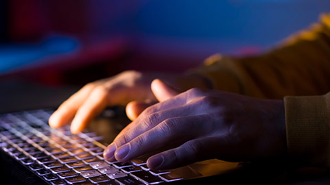 A close view of a person typing on a keyboard