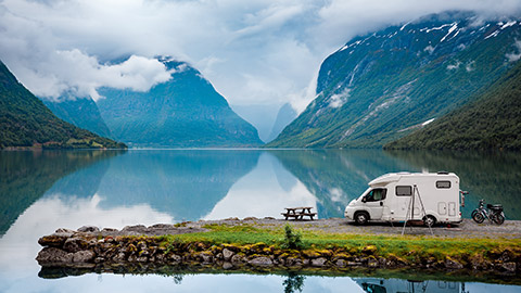 A campervan by a lake