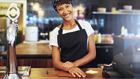 A smiling hospitality worker