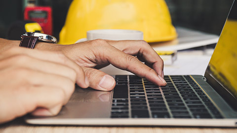 A close view of a person typing on a laptop keyboard