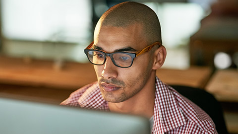 A person reading information from a computer screen