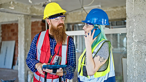 Builders talking on a site