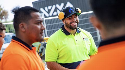 A supervisor talking to apprentices