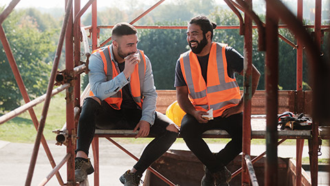 2 coworkers talking on a job site