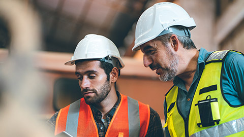 2 engineers talking on a building site