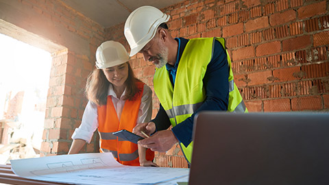 Construction managers checking up on a project