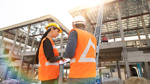 Two people talking on a job site