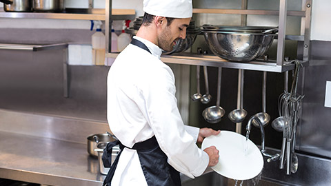 A person washing dishes