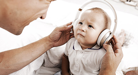 A very young child doing an activity