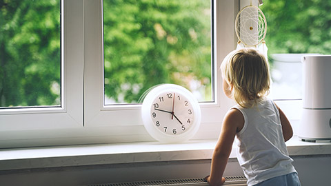 A small child looking out the window