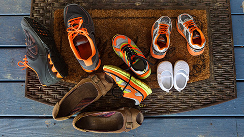 A bunch of shoes on a mat