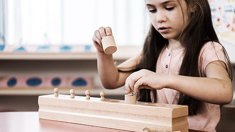 A child playing  with blocks