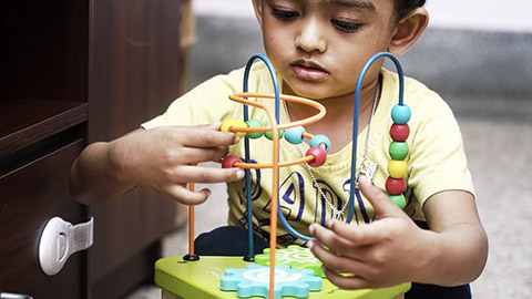 A child playing with 3d puzzle