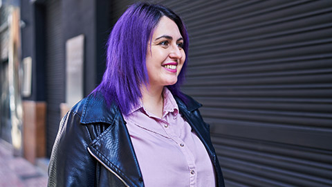 A happy childcare worker outdoors