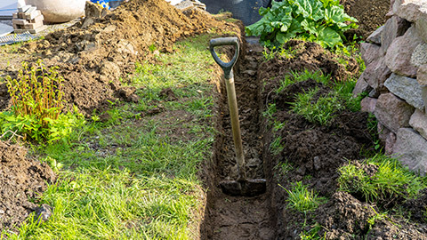 A drainage trench near a garden