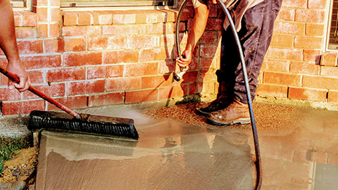 People pouring a concrete slab