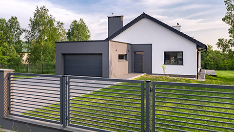 A modern home with a basic fence