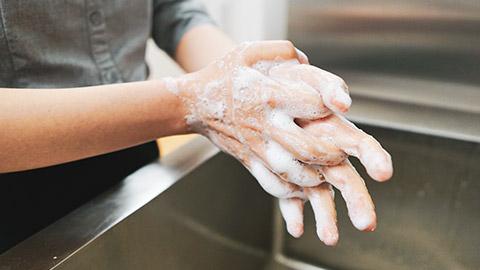 A person washing their hands