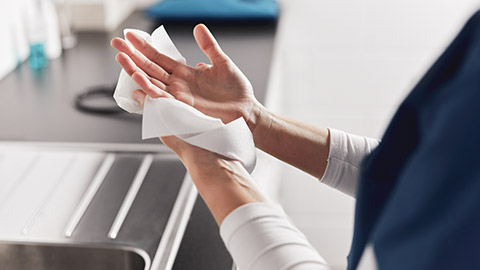 A medical professional washing their hands