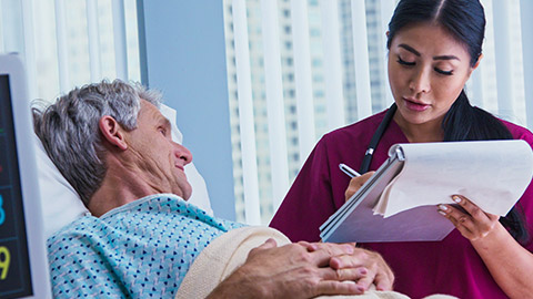 A nurse talking to a patient