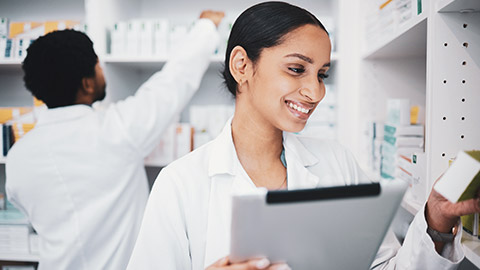 A pharmacist reading a label