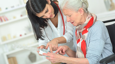 A pharmacist talking to a patient