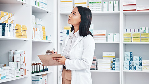 A pharmacist checking stock