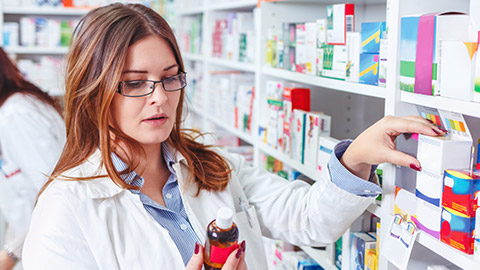 A pharmacist looking at medicine