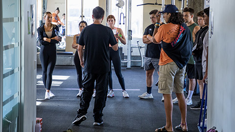 A personal trainer running a class