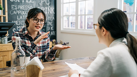 asian young girl talks about her experience for job interview in cafe bar