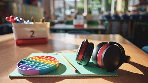 Various learning aids on a desk in a classroom