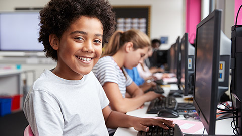 A young child working on a computer