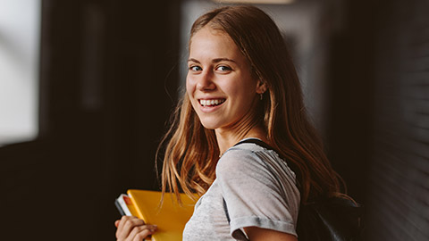 A teenage girl smiling at the camera