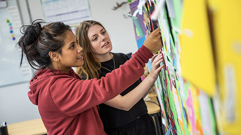 Students working on a bulletin board