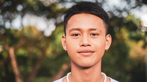 A close portrait of a teenager of islander heritage