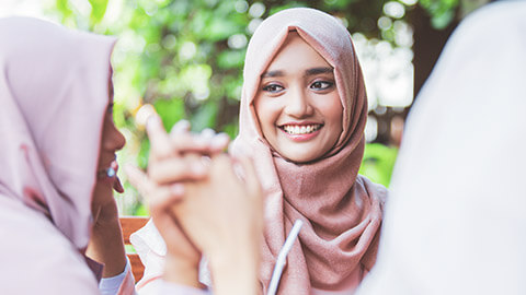 A group of young muslim women talking and smiling