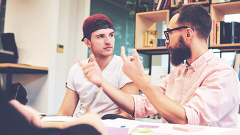 A youth worker talking to a colleague about work