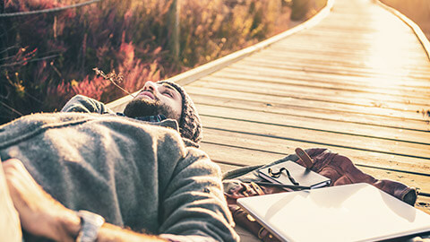 A youth worker chilling in the outdoors after a hard day at work