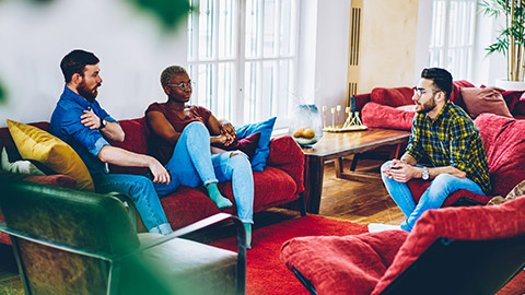 A group of youth workers debriefing in a casual space