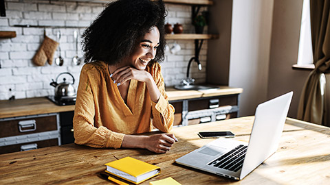 A person happily working at home