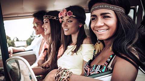 Multi ethnic friends on mini van