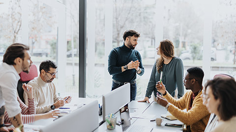 A group of professionals collaborating and working together in a modern office